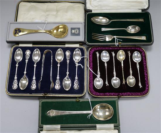 A Georg Jensen silver gilt and enamel spoon for 1977 and sundry silver cased flatware,